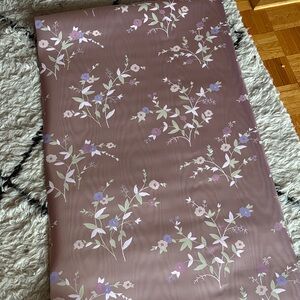Vintage wallpaper Floral Patterned with a shiny mauve pinkish purple background